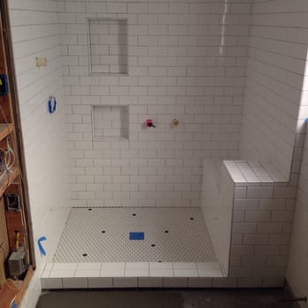 Taylor Made Tile Works - Custom built shower. Dal 3x6 subway. Hex floor and shower pan. Random black dots. In progress. - Tiling Near Me Taylor Made Tile Works - Custom built shower. Dal 3x6 subway. Hex floor and shower pan. Random black dots. In progress. - Tiling Near Me