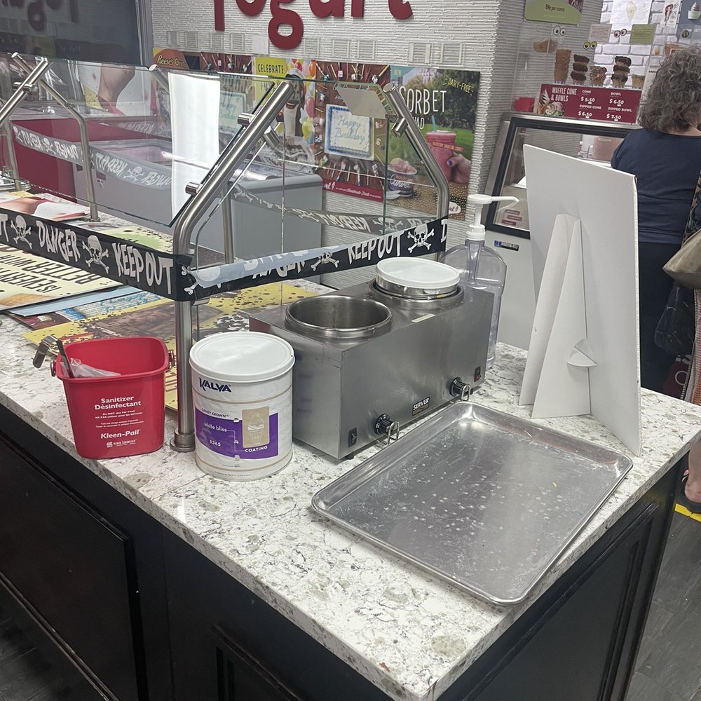 Carvel - Dirty tray and cleaning supplies in the closed topping station. - Desserts Near Me - Stamford, Connecticut