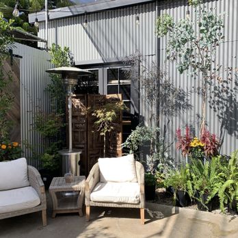 Garden District Super Foods - This store is combined w/Devynn's Garden so the plants in here make for a nice seating space, and you could buy some while you are here! - Juice Bars & Smoothies Near Me - Seal Beach, California