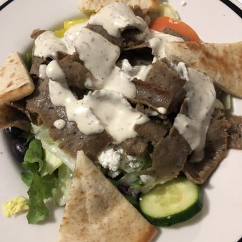 Yanni's Greek Grill - Gyro salad with gyro meat from the spit, cukes, pita, peppercini, olives, feta atop greens with a garlicky dressing - Greek Near Me - Columbus, Ohio Yanni's Greek Grill - Gyro salad with gyro meat from the spit, cukes, pita, peppercini, olives, feta atop greens with a garlicky dressing - Greek Near Me - Columbus, Ohio