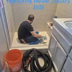 Cline Remodeling & Repair - Roger applying new grout in our shower