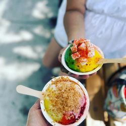 Ululani's Hawaiian Shave Ice - Our shave ice! Sour tart with fresh mochi topping and a cherry-banana-passion orange with a "snow cap" topping and toasted coconut - yum!