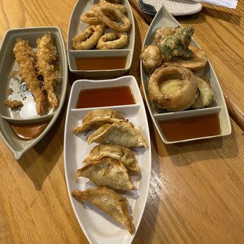 Oishii - Shrimp Tempura (left$), Fried squid (top), Gyoza (bottom) and Fried vegetables (right). - Sushi Bars Near Me - Houston, Texas Oishii - Shrimp Tempura (left$), Fried squid (top), Gyoza (bottom) and Fried vegetables (right). - Sushi Bars Near Me - Houston, Texas