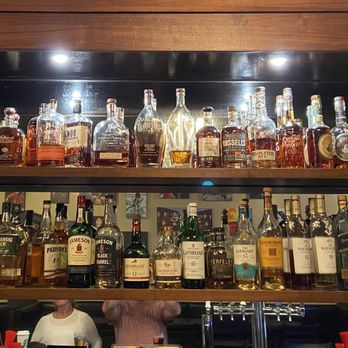 Celtic Crossing Irish Pub - a shelf full of liquor bottles - Irish Pub Near Me - Chicago, Illinois