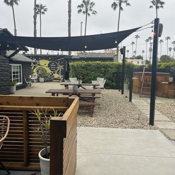 The Green Room Hotel - The common area with a hot tub and fire pit. - Hotels Near Me - Oceanside, California