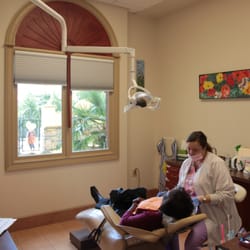 Kim Henry, DMD PC - Our comfortable treatment rooms allow views of the courtyard, complete with fountain and exotic plants.