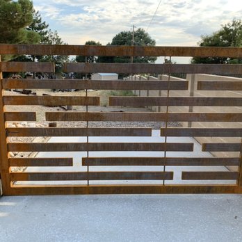 ADE Wrought Iron - Custom drive in gate done in a rust finish - Fences & Gates Near Me