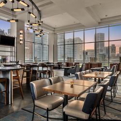 Welcome the sunset city view with a cocktails and delicious meal at FUELL.