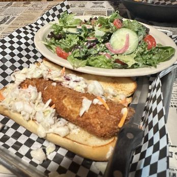 The Snake Pit - Trout Po'Boy with side salad - Pubs Near Me - Enaville, Idaho