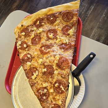Richie B’s Pizza - Monster slice with peperoni and pineapple. - Pizza Near Me - Albuquerque, New Mexico