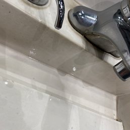 a faucet and a sink in a bathroom a faucet and a sink in a bathroom