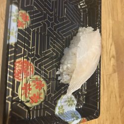 Wako Roll - The replacement piece of fish that flew off the board when the staff member set the food down. Why is it so stiff defying gravity ??