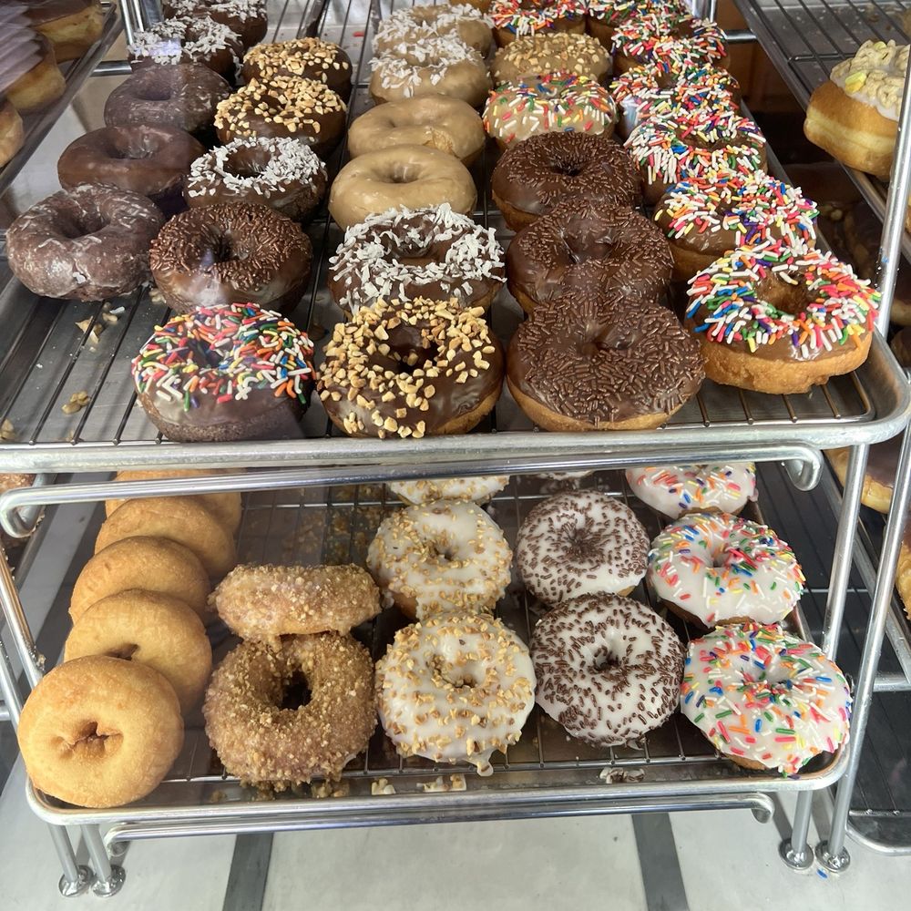 Happy Donuts - a variety of doughnuts on display - Donuts Near Me - Windsor, California Happy Donuts - a variety of doughnuts on display - Donuts Near Me - Windsor, California
