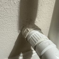 Ecowater Systems - DIRECT connection to my clear out drain. License plumbers said T curve is needed.