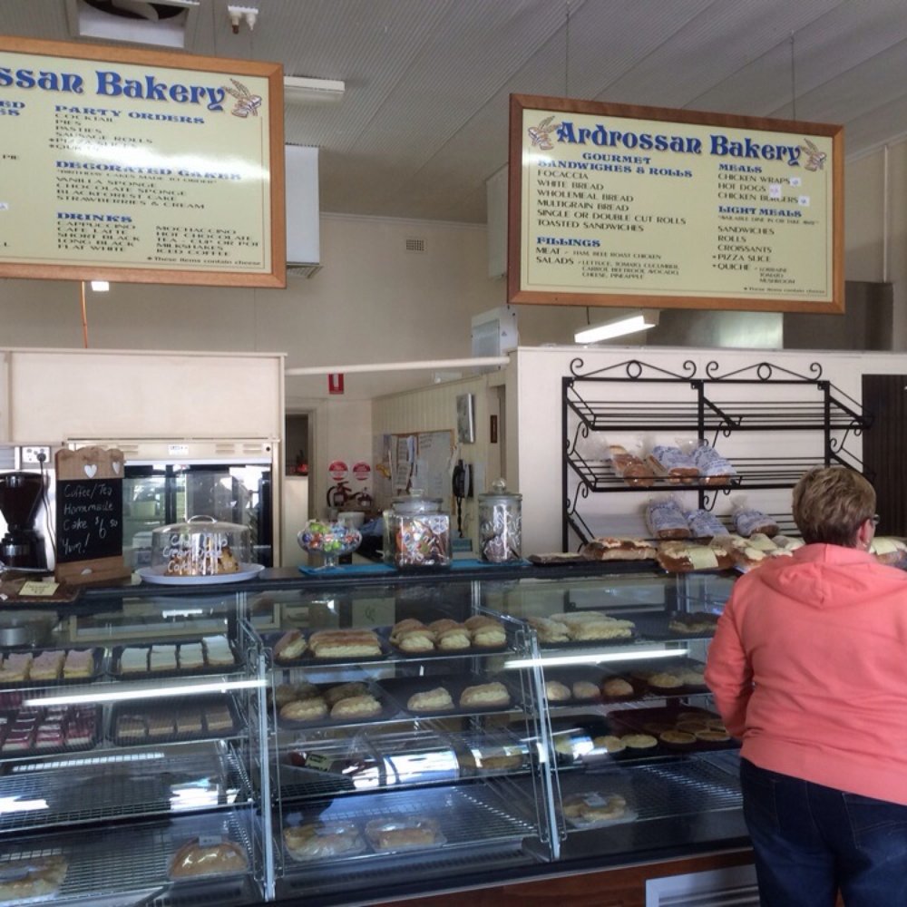 Ardrossan Bakery - An eager customer fronts the imposing bakery counter. Her body language says it all: 'For the love of God, another Kitchener bun, quick!' - Bakeries Near Me - Ardrossan, SA