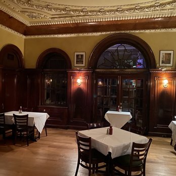The Brewer's Art - Upstairs dining room with old timey trim work. - Breweries Near Me - Baltimore, Maryland