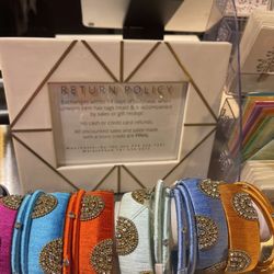Mahri - Here's the return policy. Those bracelets in front are the cheapest thing in store. Everything is overpriced