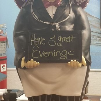Casa Real - Little man with sign greets you - Mexican Near Me - Otsego, Michigan