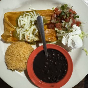 Oli's Kitchen Bar & Grill - Tamales with green sauce and cheese, black beans. - Mexican Near Me - Marble Falls, Texas