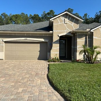 Rhino Shield - House original stucco with repaired cracks before Rhino Shield. - Painters Near Me - Jacksonville, Florida