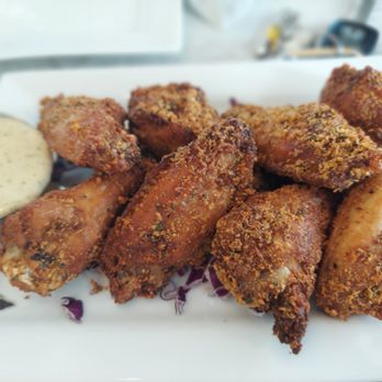 The Breeze - a plate of fried chicken wings with dipping sauce - Sandwiches Near Me - Gilford, New Hampshire The Breeze - a plate of fried chicken wings with dipping sauce - Sandwiches Near Me - Gilford, New Hampshire