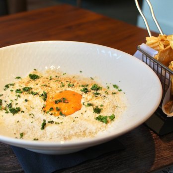 Margie's Haas - The St Jakobsmuschel is a torched scallop and crab dip with a spicy masago mayo crust & served alongside kettle chips. - New American Near Me - Vail, Colorado