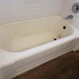 3-4 layers of previous glaze. The tub is clean. Just stained and glaze chipped and rusted. Another company reglazed it a year ago.