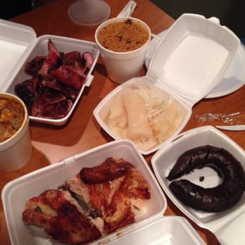 Bebo's BBQ - Our feast! Roast chicken, ribs, blood sausage, yucca, arroz con gandules. - Barbeque Near Me - Carolina, Puerto Rico