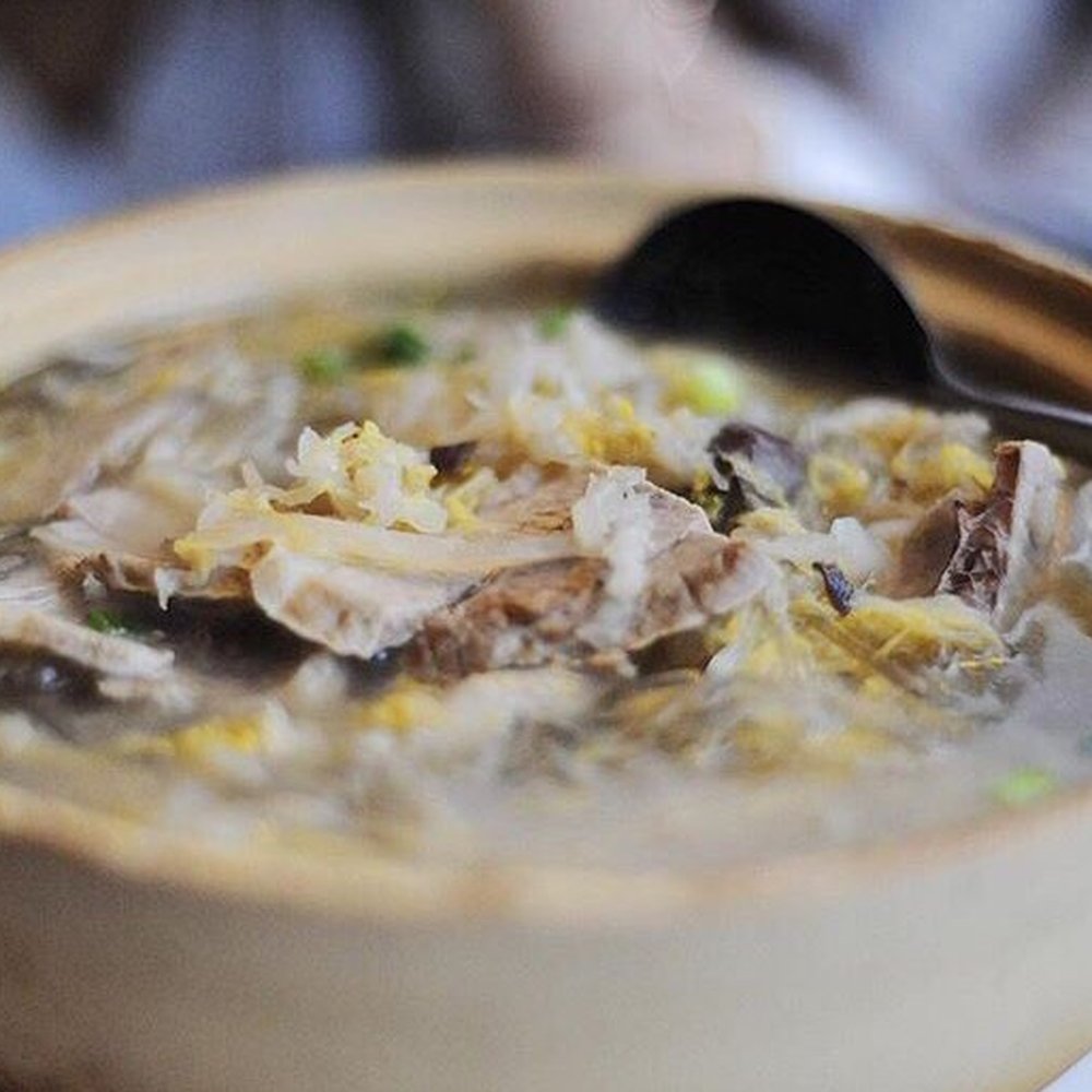 a bowl of soup with a spoon a bowl of soup with a spoon