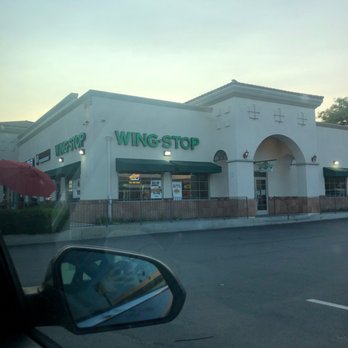 Wingstop - a view of a wingtop restaurant from a car window - Chicken Wings Near Me - La Habra, California