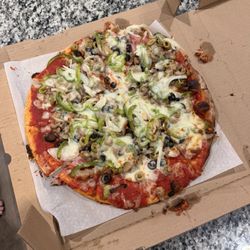 Pizza Barn - Finally arrived. Cold and toppings all over the place like it took a slide. So disappointed and will never order or eat here again.