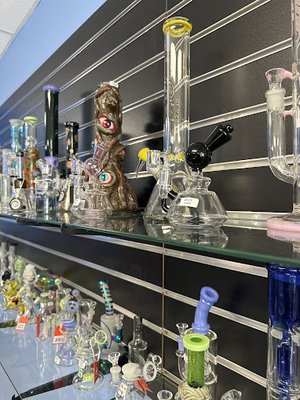 Glass Products - Elevate your collection with our premium glassware at Exotic Puff! We carry a diverse selection of hand-blown glass products, including bongs, glass pipes, dab rigs, and bubblers. Whether you’re looking for artistic, colorful pieces or sleek, minimalist designs, we have something to match your style.

Browse through top-tier glass brands known for durability and smooth hits. From compact travel pipes to intricate water pipes, we’ve got it all. Our staff can help you find the perfect piece for your sessions or as a gift for a fellow enthusiast. At Exotic Puff, we offer glassware that’s as functional as it is beautiful.