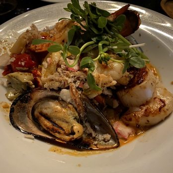 Poor Calvin's - Seafood melange with squid ink pasta - Asian Fusion Near Me - Atlanta, Georgia Poor Calvin's - Seafood melange with squid ink pasta - Asian Fusion Near Me - Atlanta, Georgia