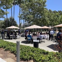 Tables, umbrellas and chairs.  Set up for 120 people