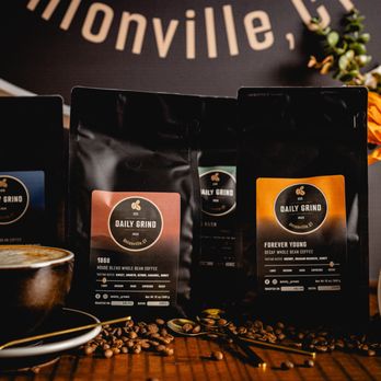 Daily Grind - three bags of coffee and a cup of coffee - Coffee & Tea Near Me - Unionville, Connecticut