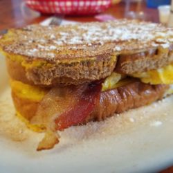Sunshine Cafe - Steve-a-Rino Sandwich: egg, bacon, and cheese on sugar-dusted French toast.
