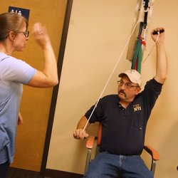 Prineville Physical Therapy - PT Christine works on correct use of the pulley for proper shoulder rehabilitation.