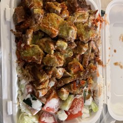 Lamb rice salad all the sauces. Nice hot sauce