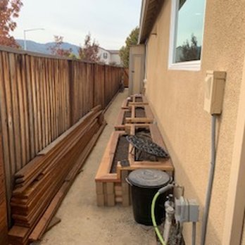 LG Construction - a row of wooden benches in front of a house - General Contractors Near Me LG Construction - a row of wooden benches in front of a house - General Contractors Near Me
