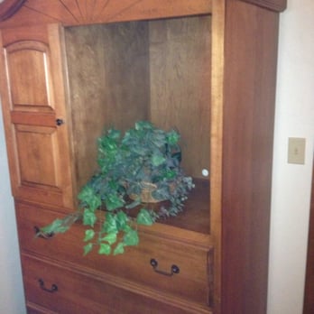 Bridgeport Waterfront Resort - Armoire with tv hole filled with plastic plant. - Resorts Near Me - Sturgeon Bay, Wisconsin Bridgeport Waterfront Resort - Armoire with tv hole filled with plastic plant. - Resorts Near Me - Sturgeon Bay, Wisconsin