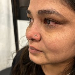 Karma Piercing - Gold dolphin Nose Piercing