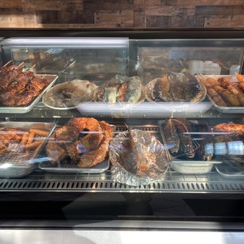 Eldric's Pinoy Cooking - Hot plate area, lechon, bbq pork stick, lumpia, fried fish. - Filipino Near Me - Anchorage, Alaska