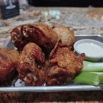 BJ's Restaurant & Brewhouse - BJ's sauced 'n' tossed chicken thighs with lemon pepper sesame dry rub - Pizza Near Me - Austin, Texas BJ's Restaurant & Brewhouse - BJ's sauced 'n' tossed chicken thighs with lemon pepper sesame dry rub - Pizza Near Me - Austin, Texas