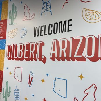 Everbowl - A large welcome sign for Gilbert, Arizona, features colorful illustrations of cacti, mountains, and desert elements. - Acai Bowls Near Me - Gilbert, Arizona