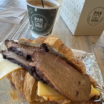 Pan Pa' Vos - Brisket and cheese croissant, cappuccino and a strawberry croissant for the road. - Bakeries Near Me - Dallas, Texas Pan Pa' Vos - Brisket and cheese croissant, cappuccino and a strawberry croissant for the road. - Bakeries Near Me - Dallas, Texas