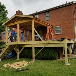 Custom Carpentry - Large deck with roof covering in Fort Thomas ky. We also installed a concrete basketball court and concrete patio with retaining wall.