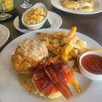 Soco Thornton Park - Chicken biscuit sandwich, mac & cheese and bacon, casserole and biscuits and gravey with crispy pork belly - Southern Near Me - Orlando, Florida Soco Thornton Park - Chicken biscuit sandwich, mac & cheese and bacon, casserole and biscuits and gravey with crispy pork belly - Southern Near Me - Orlando, Florida