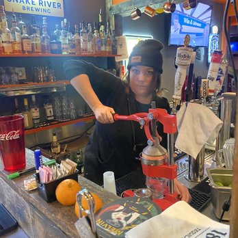 Big Hole BBQ - Jackson Hole - Jordan squeezing grapefruit for my cocktail. - Barbeque Near Me - Jackson, Wyoming Big Hole BBQ - Jackson Hole - Jordan squeezing grapefruit for my cocktail. - Barbeque Near Me - Jackson, Wyoming
