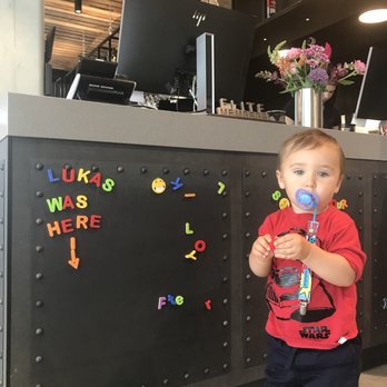 Moxy Amsterdam Houthavens - Lukas leaving his mark at the front desk - Hotels Near Me - Amsterdam, New Hampshire
