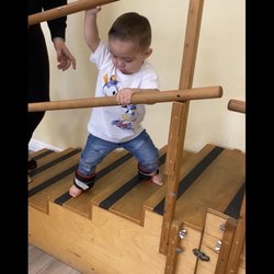 Bright Star Physical Therapy - Noah... wearing weights going up and down steps